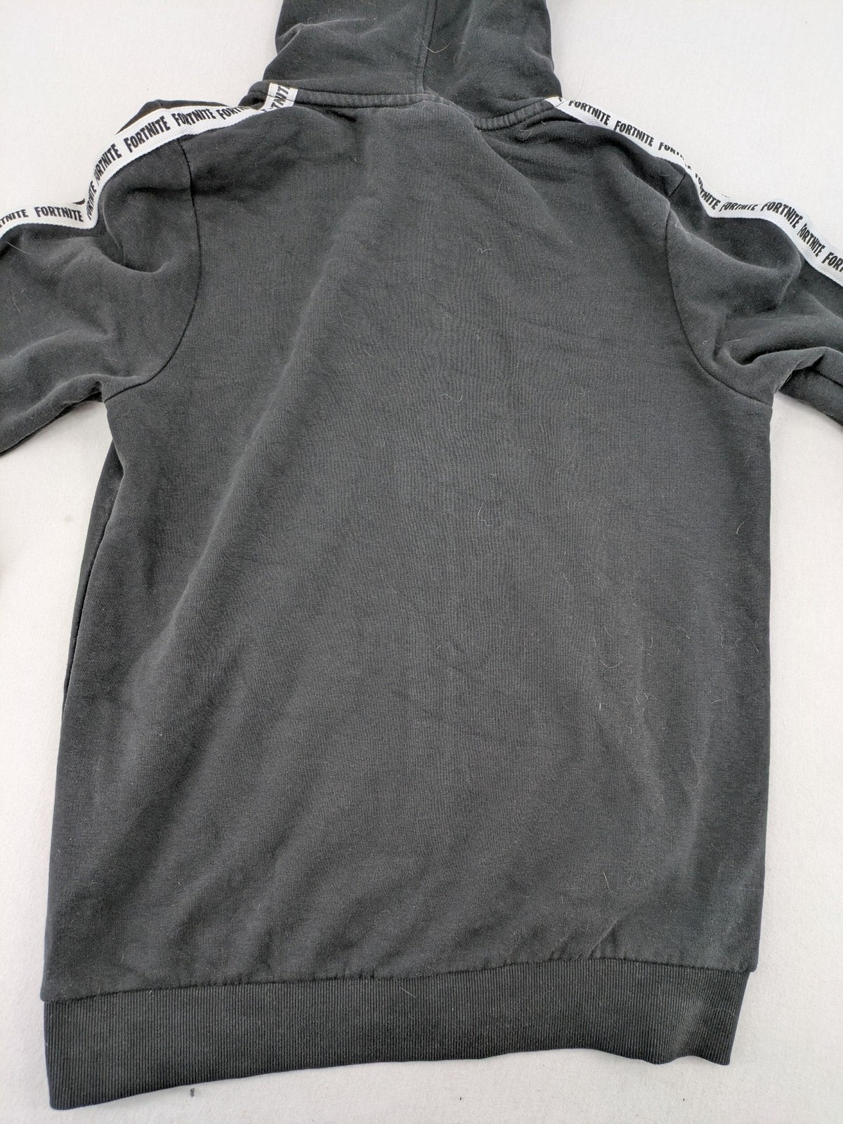 Fortnite black zip-through hoodie with logo on sleeves and Black Knight patch on chest.