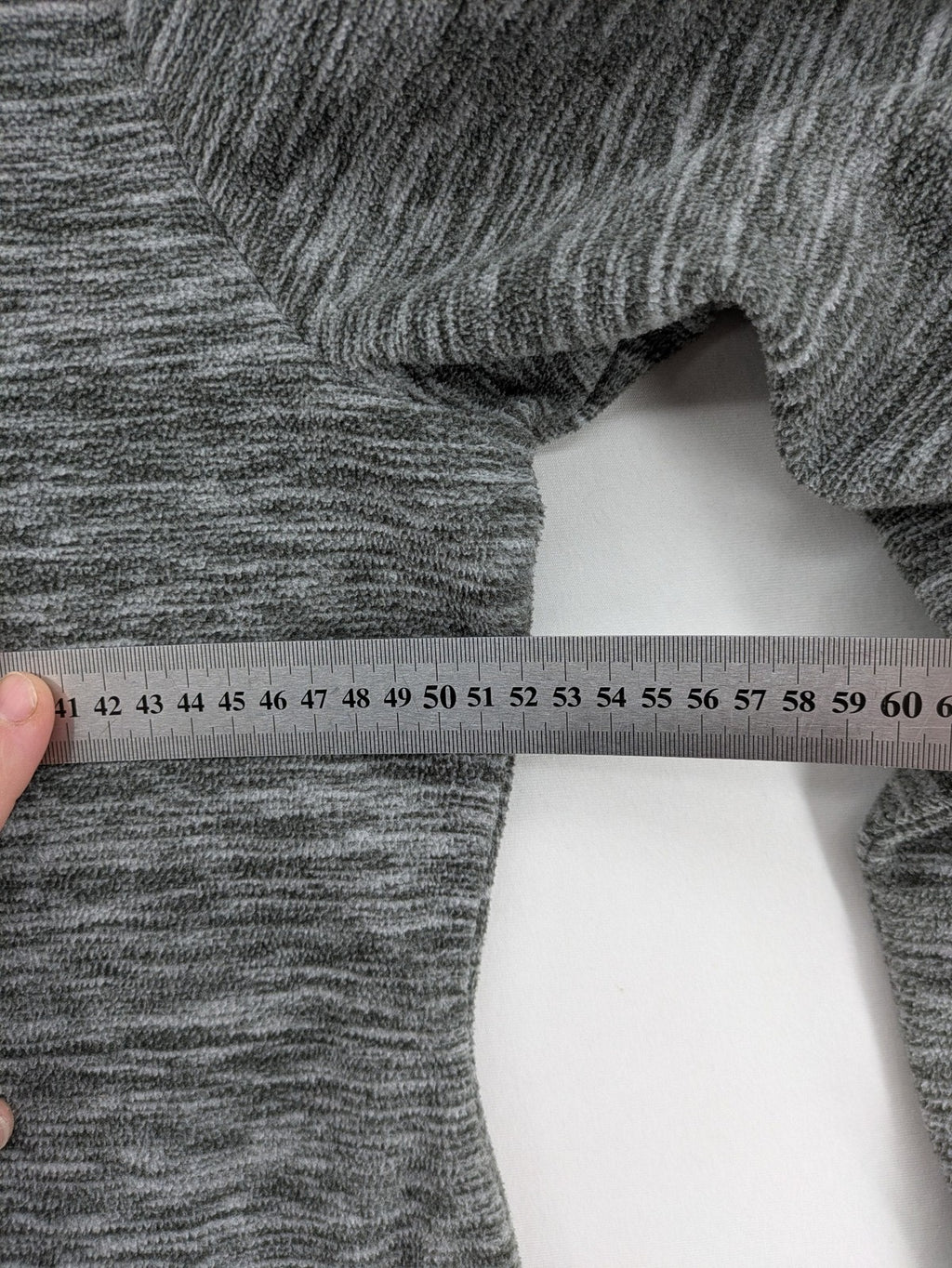 Crane grey fleece turtle neck jumper with adjustable drawstring hood and melange fabric.