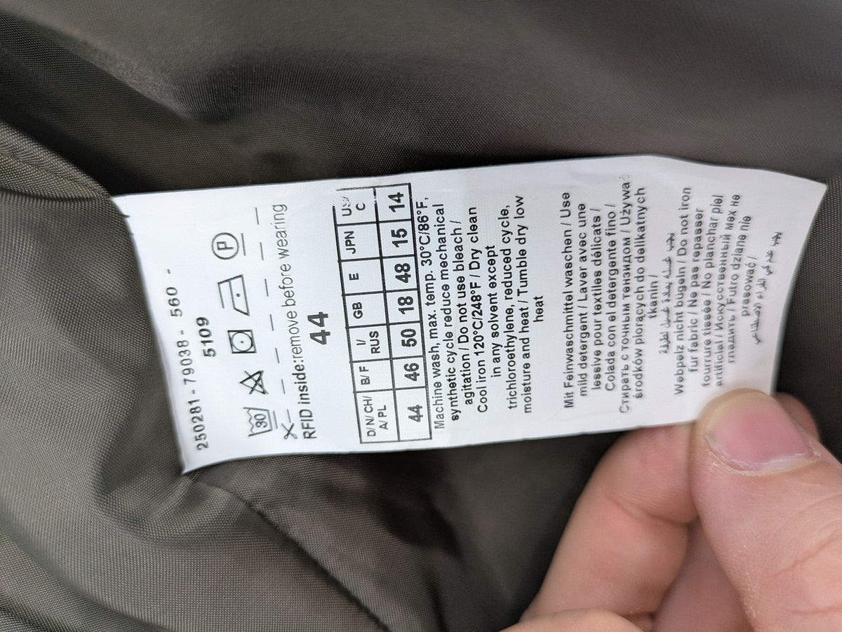 Gerry Weber Edition grey quilted coat with faux fur collar and metal toggle closures.