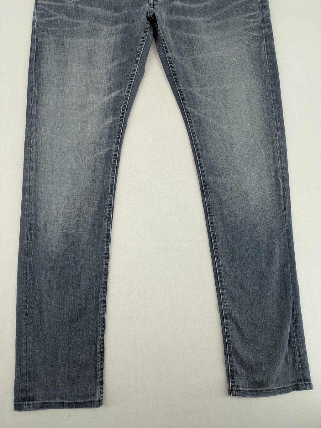 G-Star Raw grey denim straight jeans with classic button fly and subtle branding details.