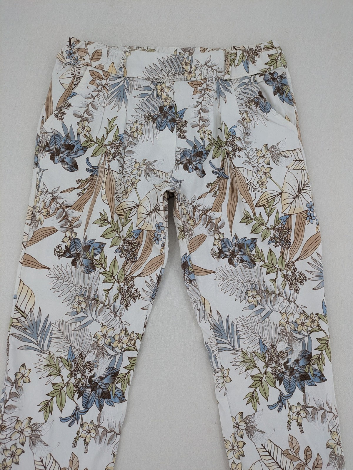 Made in Italy multi pants tropical floral pattern cotton-viscose blend on white background.