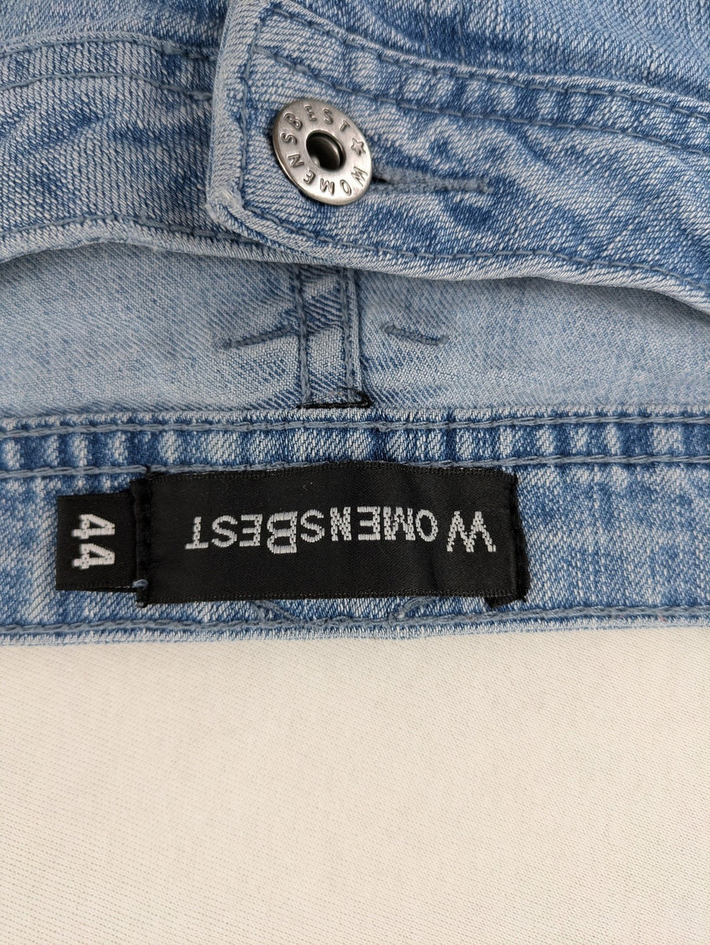 Capri blue straight jeans with 5-pocket design and embroidered details on back pockets.