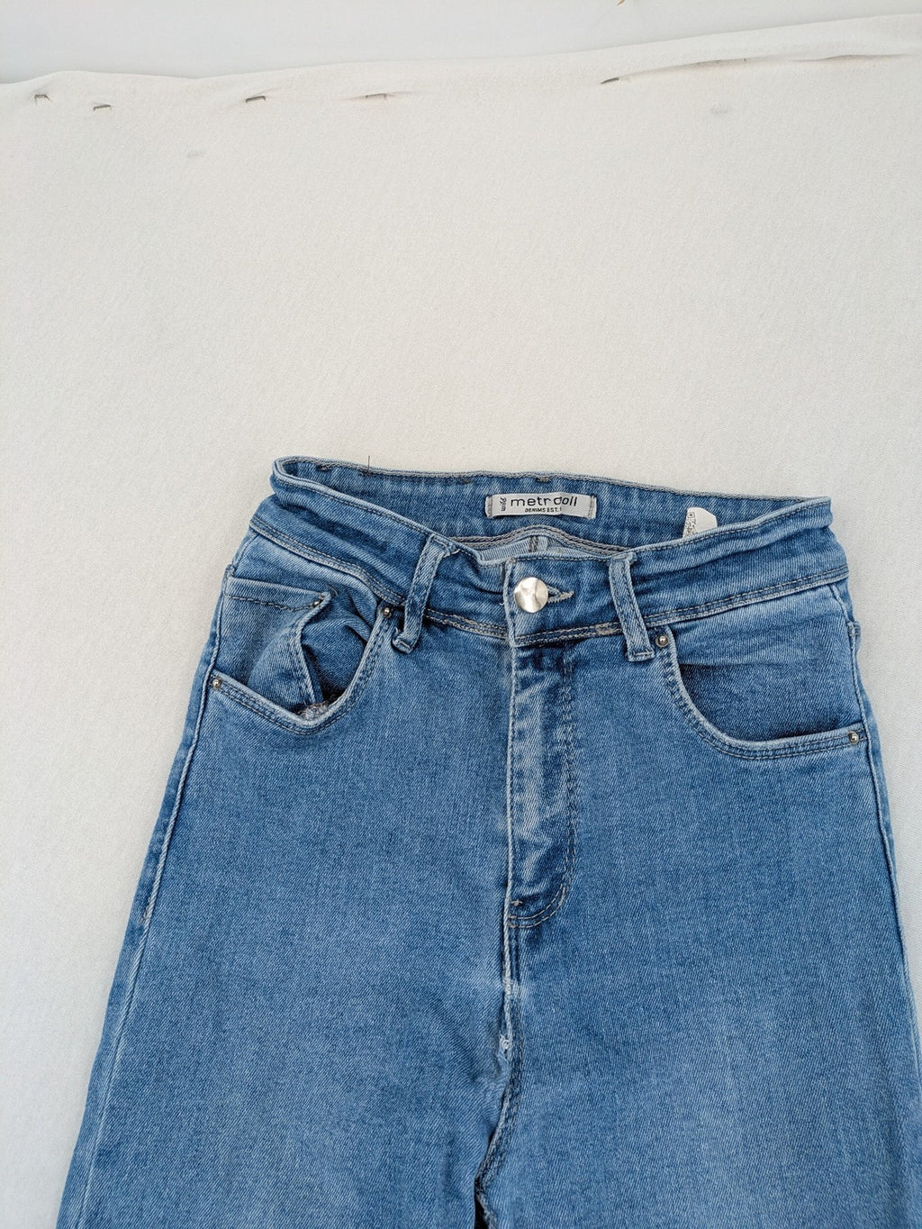 Metropoll blue high waist skinny jeans with frayed hem and classic 5-pocket design.
