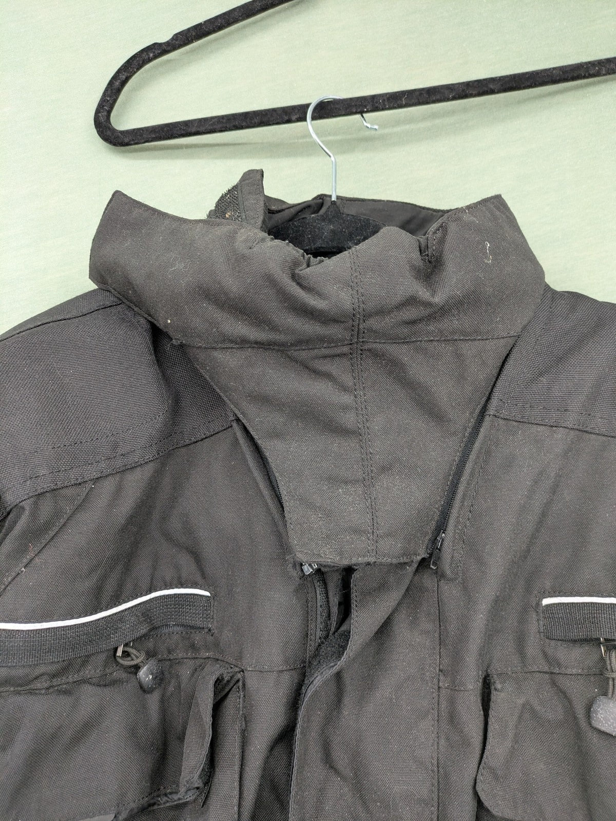 Advanced Experience black motorcycle jacket with Z-Liner membrane and CE protectors, durable Cordura material.
