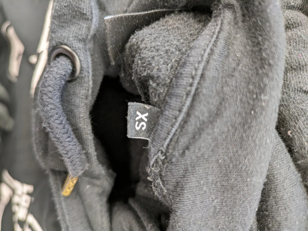 NFL black hoodie all-over team logo print, adjustable hood, cotton blend material.