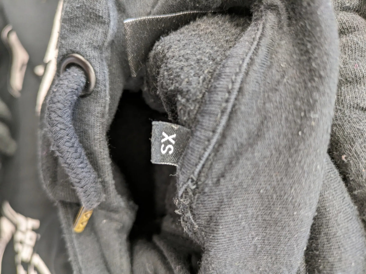 NFL black hoodie all-over team logo print, adjustable hood, cotton blend material.