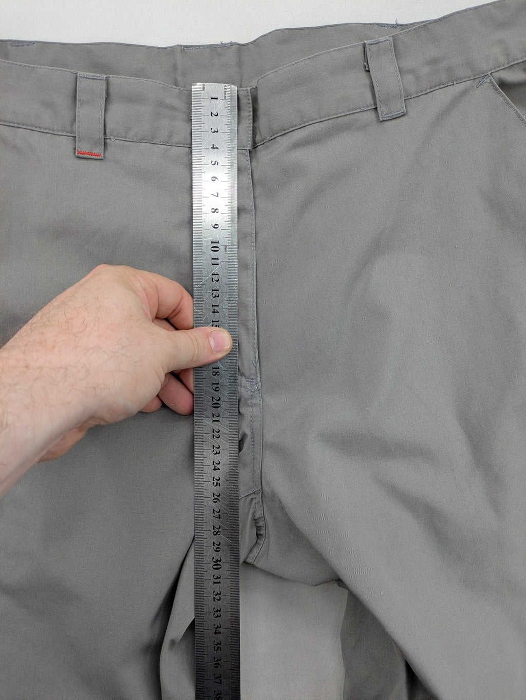 YETI grey cargo pants with multiple zippered pockets and durable material.