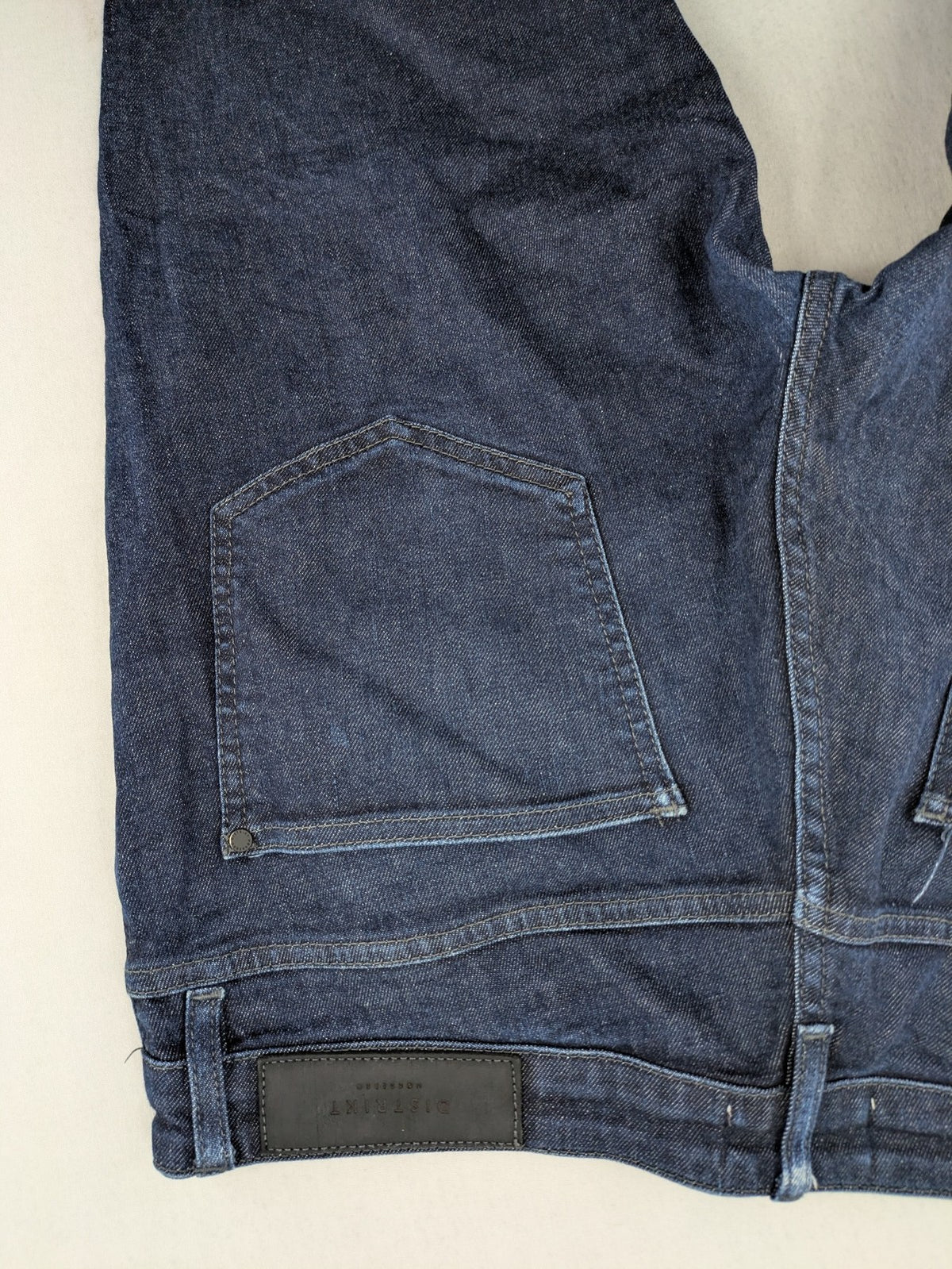 DISTRIKT NØRREBRO blue slim fit jeans with classic rinse wash and stretch denim material.