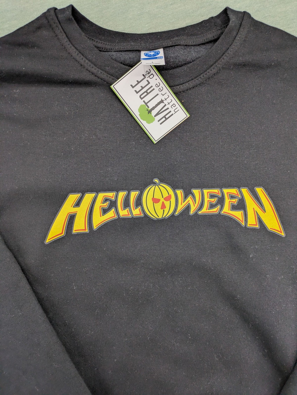 Helloween grey sweatshirt featuring bright yellow pumpkin logo, made from cotton blend.