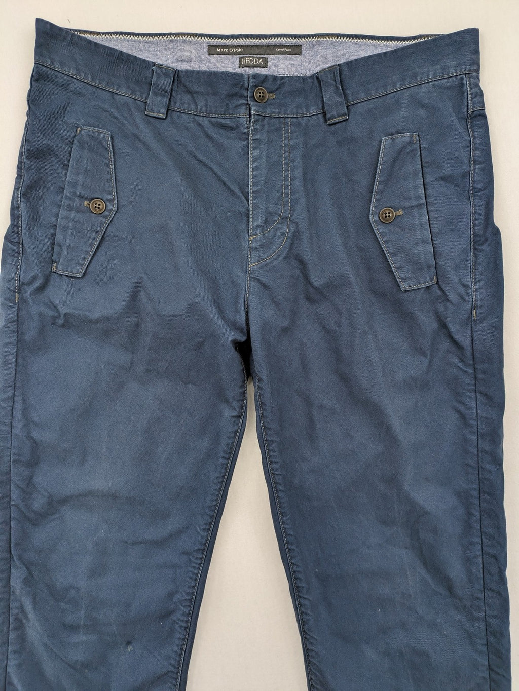 Marc O'Polo blue chino pants with button flap pockets and relaxed fit design.