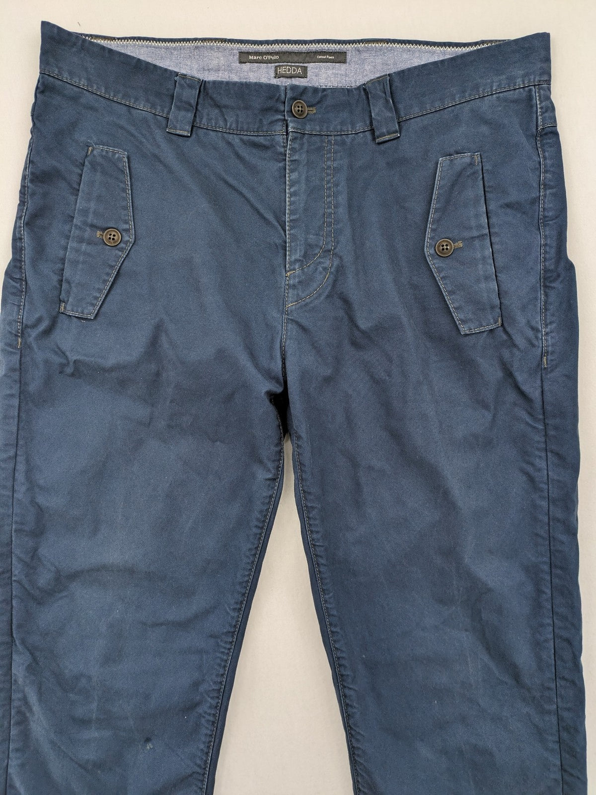 Marc O'Polo blue chino pants with button flap pockets and relaxed fit design.