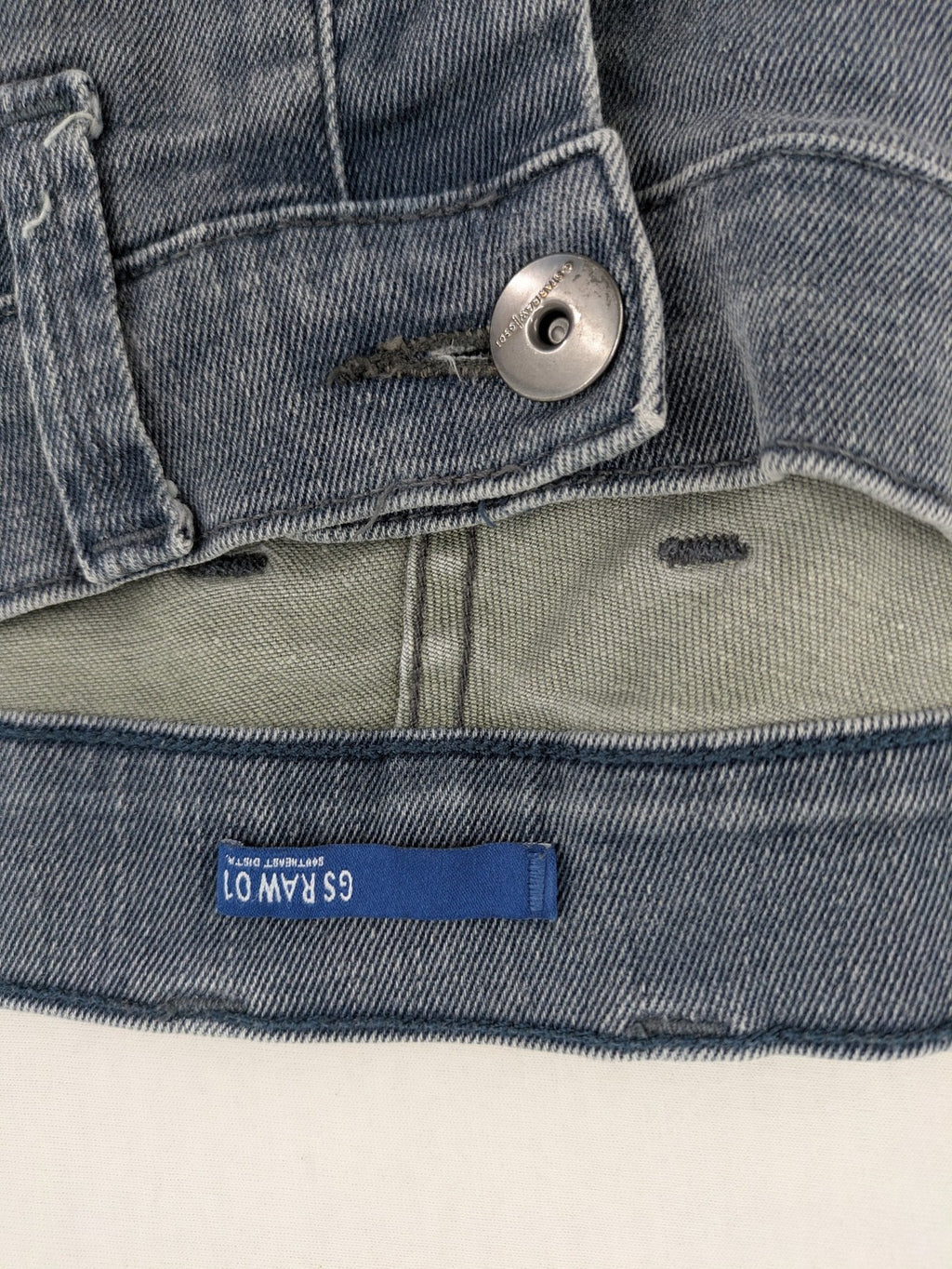 G-Star Raw grey denim straight jeans with classic button fly and subtle branding details.