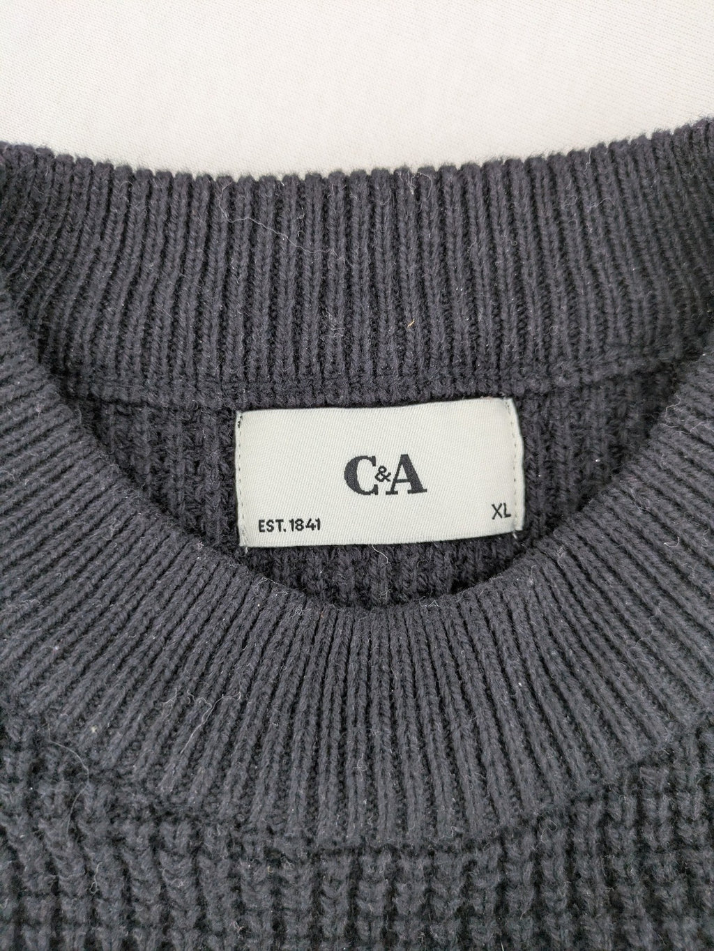 C&A turtle neck jumper black cream with Nordic pattern and waffle knit texture.