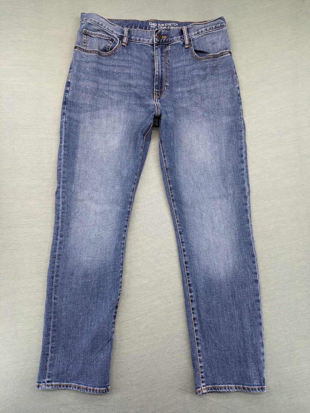 Gap blue straight jeans slim stretch fit with classic denim wash and logo tag.
