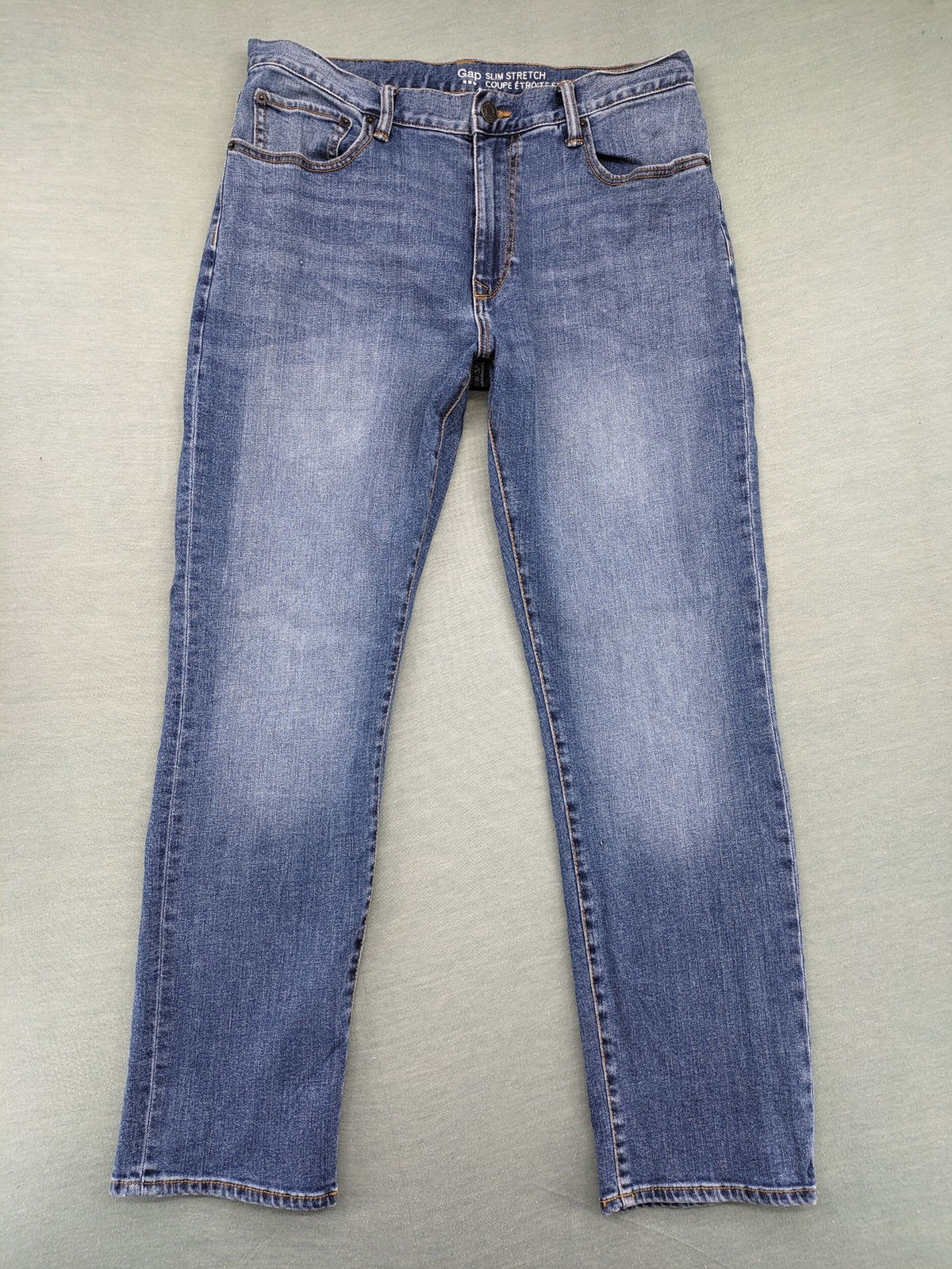 Gap blue straight jeans slim stretch fit with classic denim wash and logo tag.