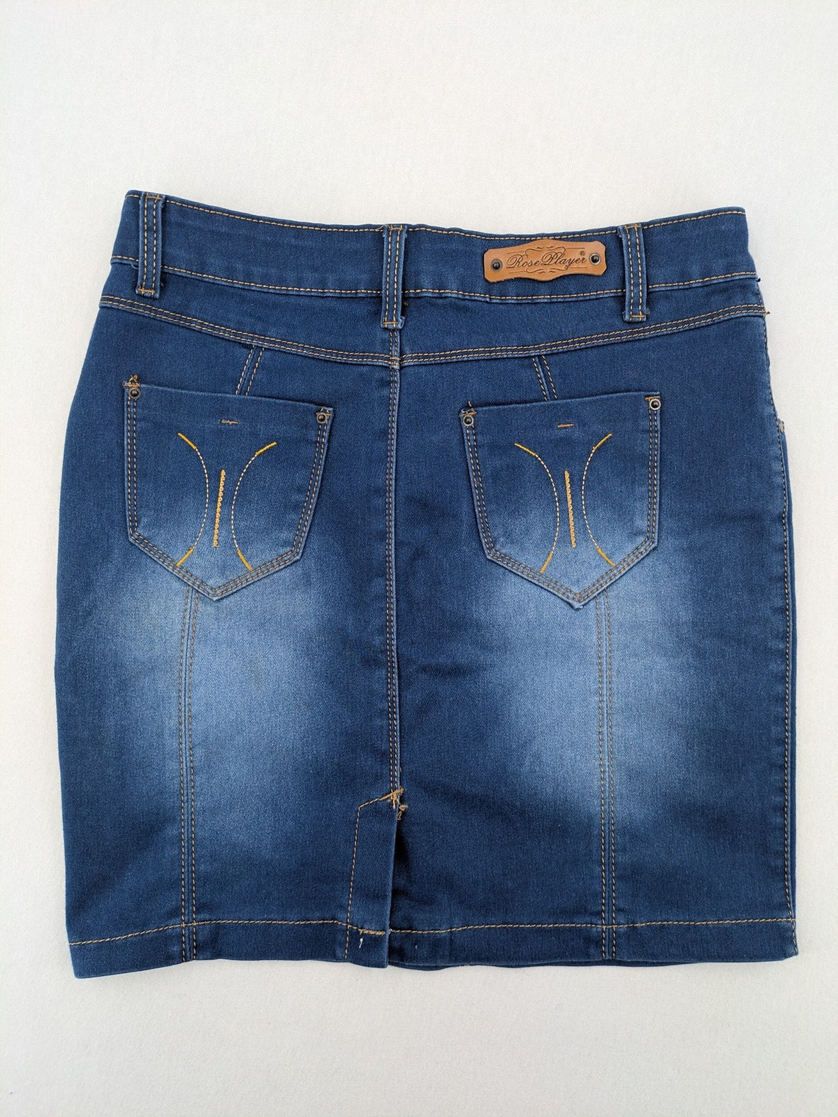 Rose Player pink denim pencil skirt, five-pocket design, comfortable stretch material.