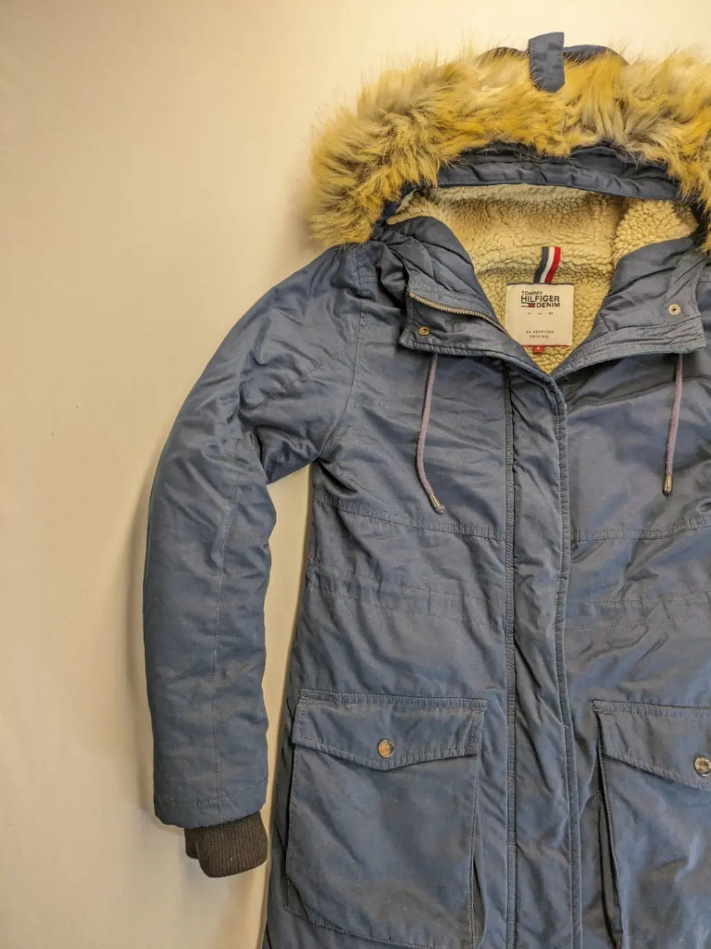 Tommy Hilfiger Denim blue parka coat with faux fur hood and Sherpa lining.