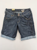 H&M blue denim shorts with rolled cuffs and back patch pockets, mid-rise fit.