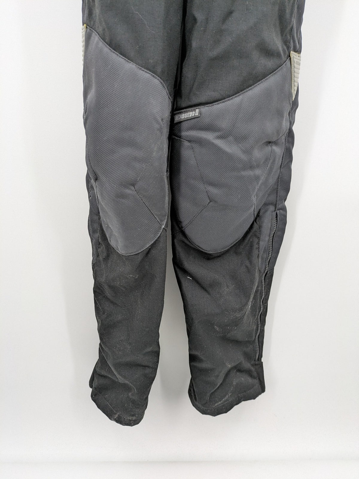 Hein Gericke black chaps with adjustable suspenders, made from durable Cordura and Kevlar.
