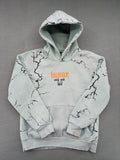 Tupac black and green zip-through hoodie with "Only God Can Judge Me" front print and angel wings graphic.