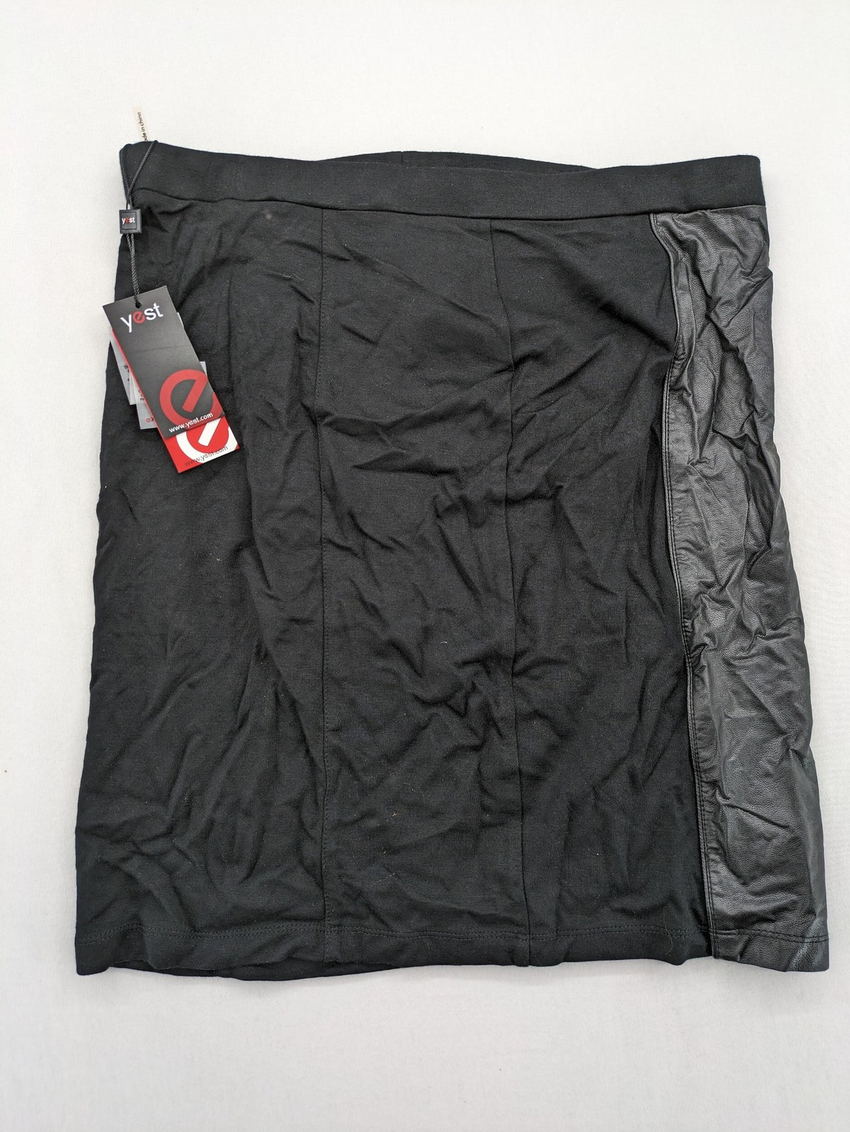 Yest black long skirt with grey faux leather panel and stretchy fabric.
