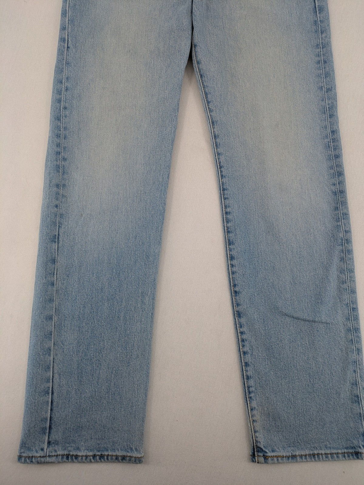 Levi's blue straight jeans light wash denim with button fly and classic fit.
