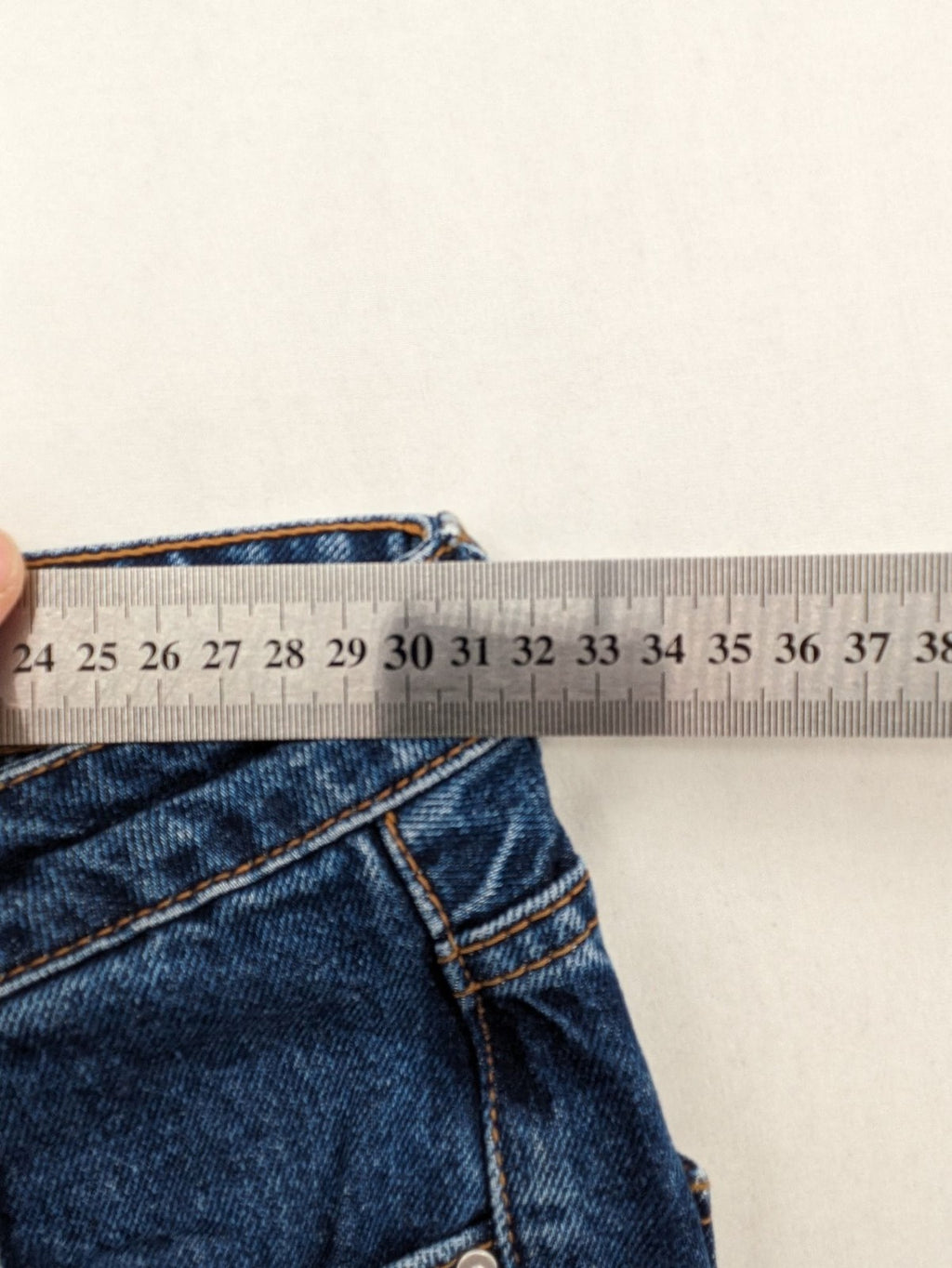 Stradivarius blue mom jeans high waist with button fly and classic denim texture.