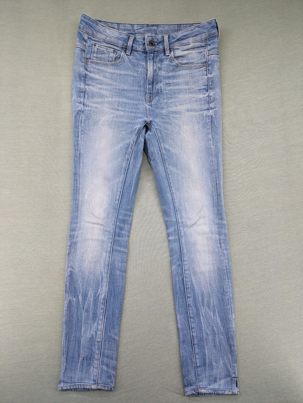 G-Star Raw blue slim skinny jeans with light wash and signature back zip pocket.