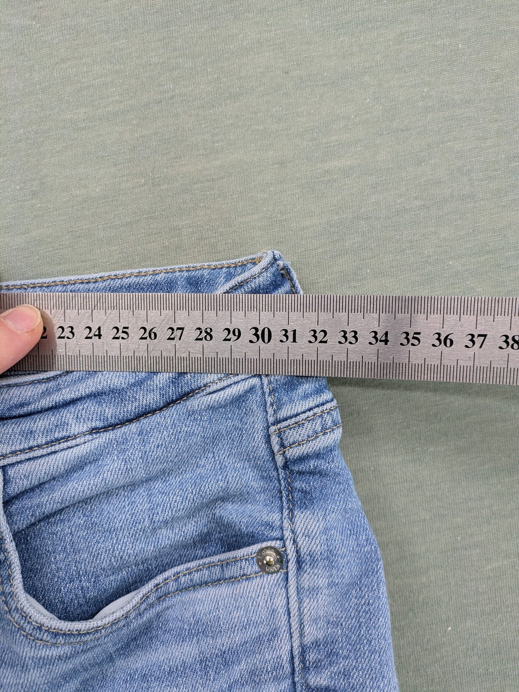 Calvin Klein Jeans blue high rise super skinny ankle jeans with logo patch and stretch material.