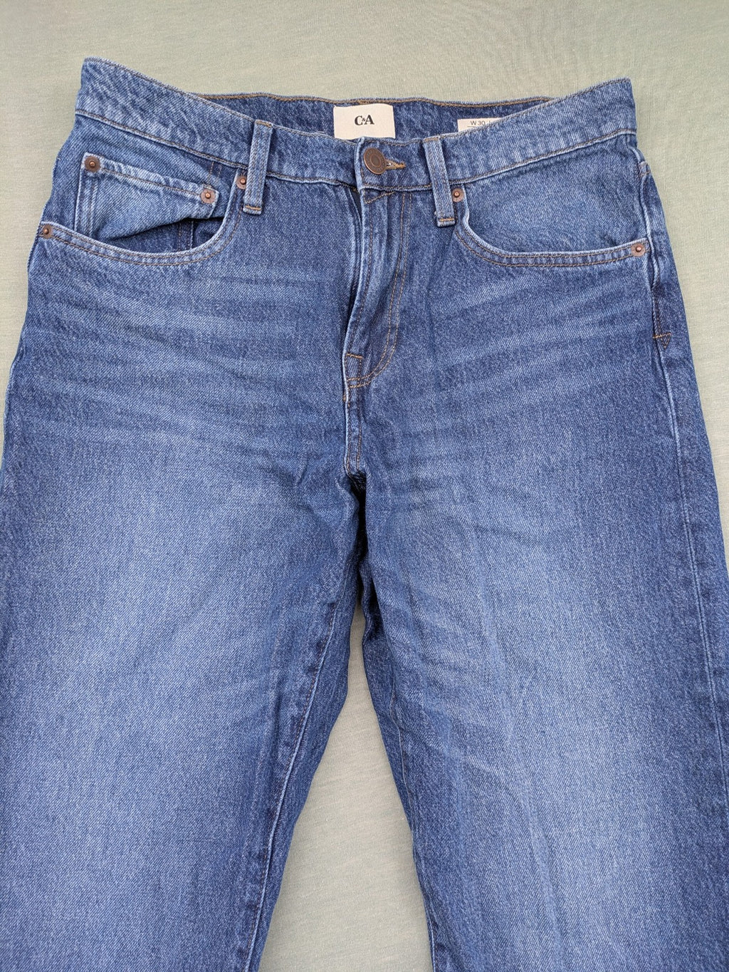 C&A blue straight jeans relaxed fit with traditional button fly and 5-pocket design.