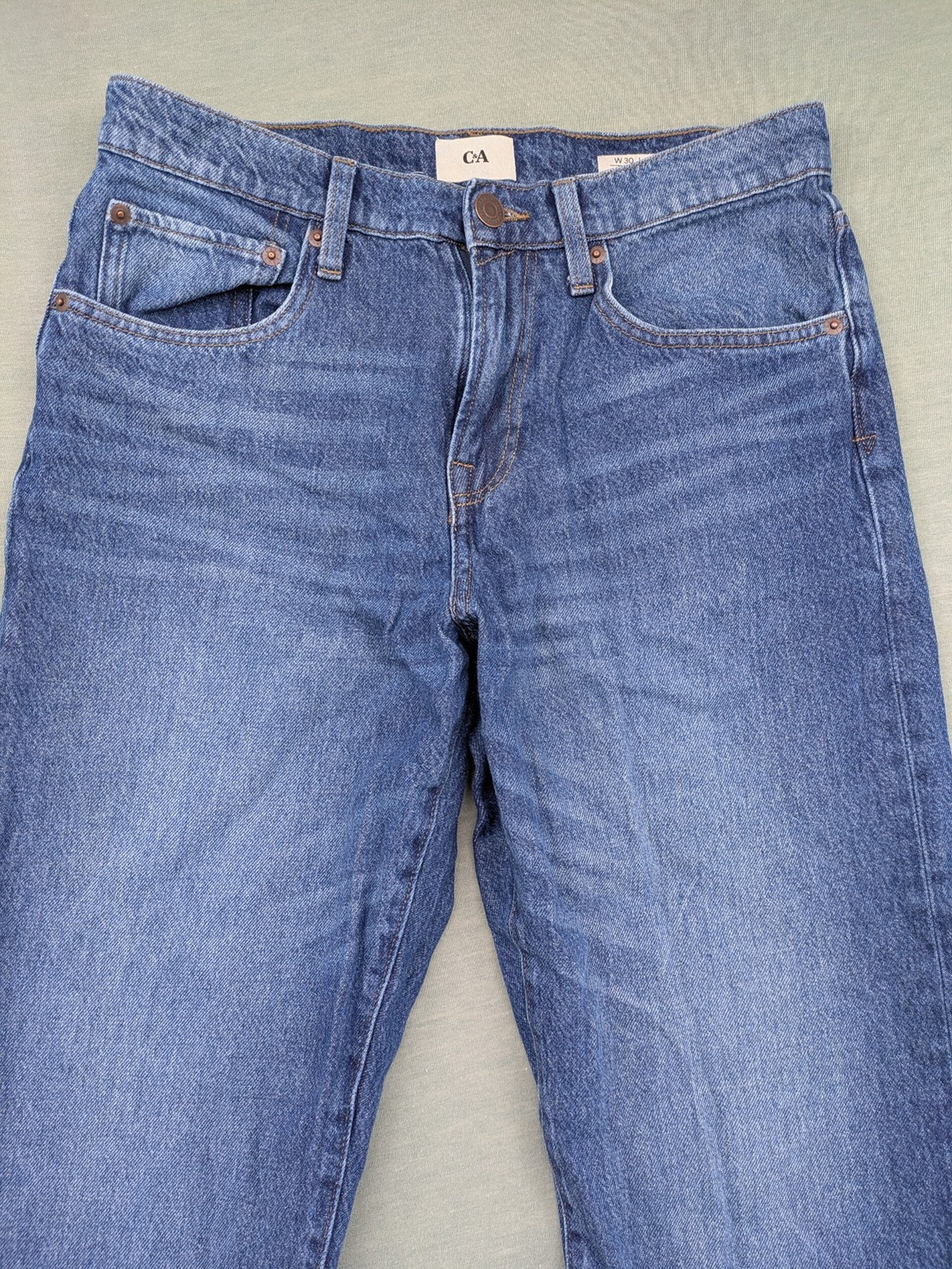 C&A blue straight jeans relaxed fit with traditional button fly and 5-pocket design.