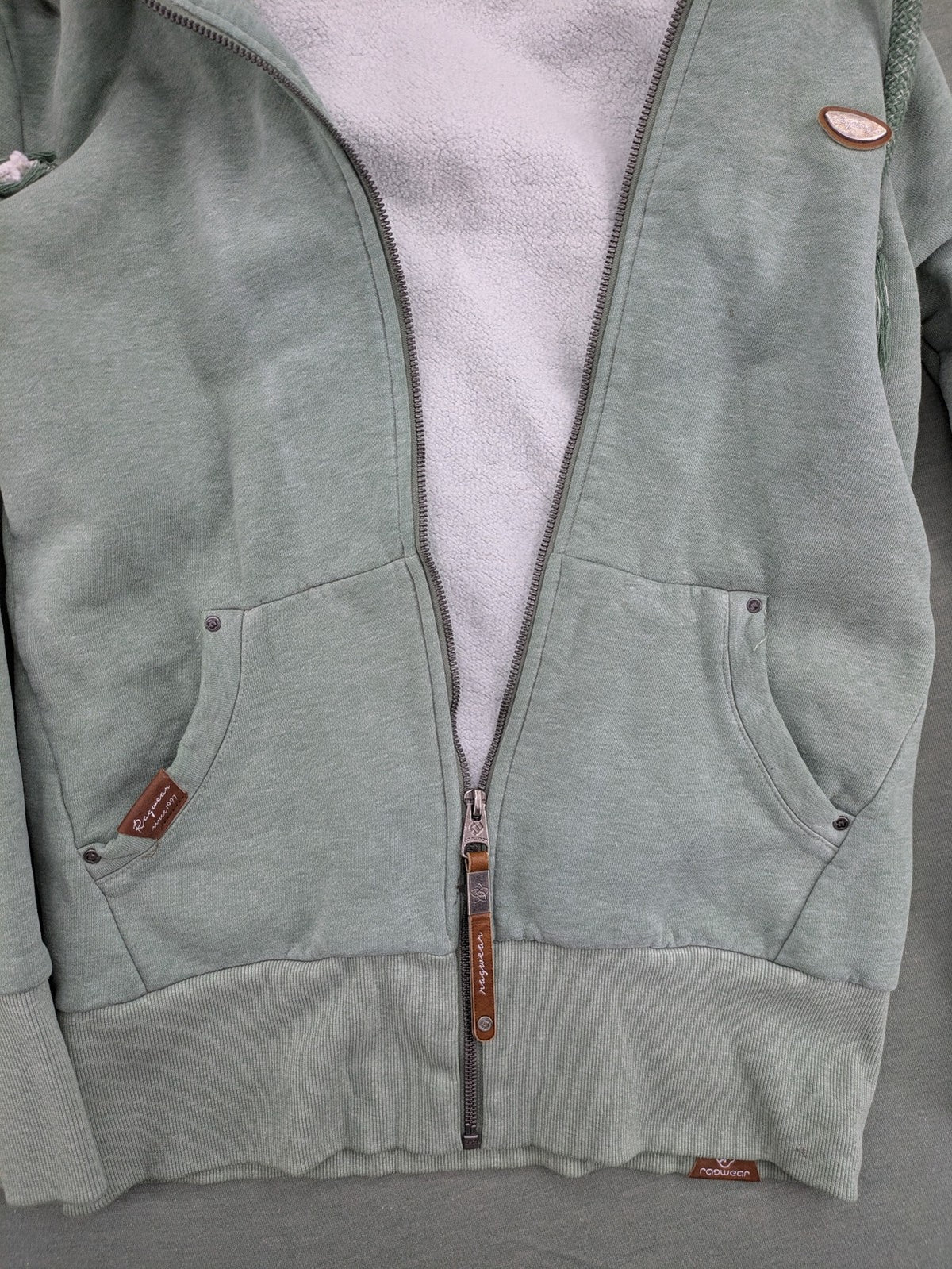 Ragwear grey hoodie jacket with high collar, thick drawstrings, and vegan materials.