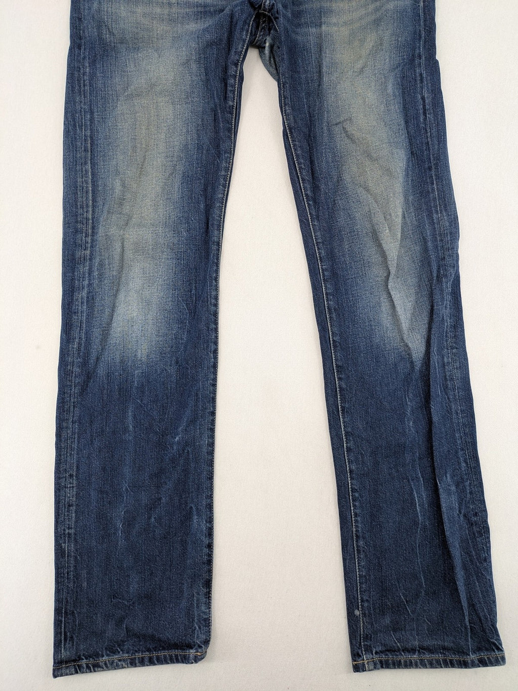 Hilfiger Denim blue straight jeans faded wash with Tommy Hilfiger flag logo on pocket.