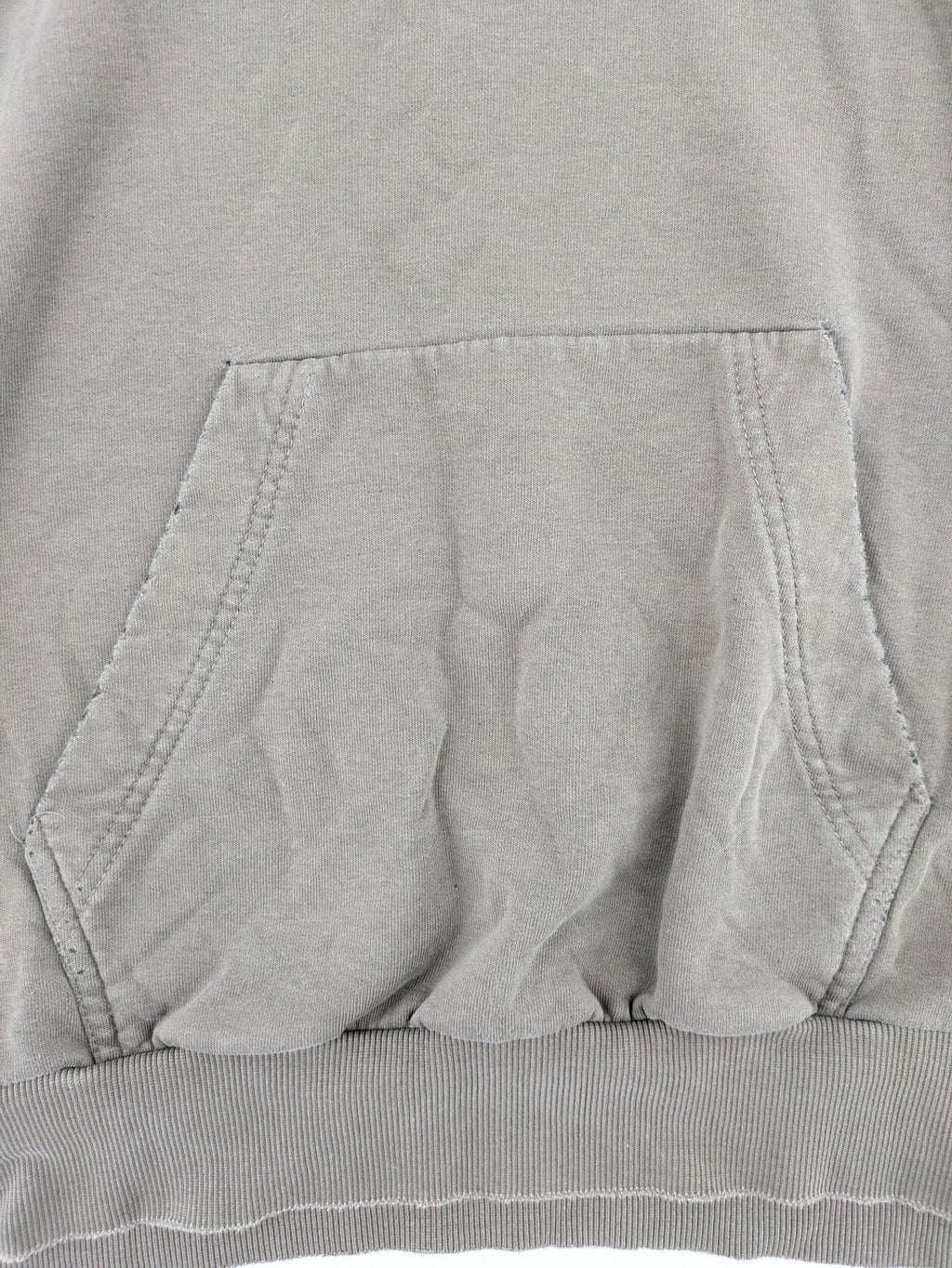 Mosquito grey hoodie with distressed cuffs and subtle logo on the chest.