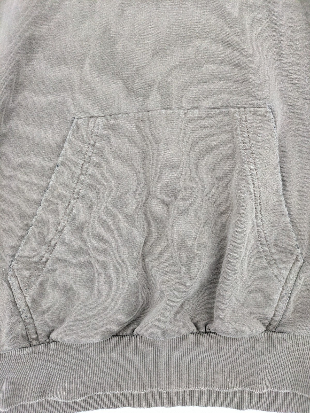 Mosquito grey hoodie with distressed cuffs and subtle logo on the chest.