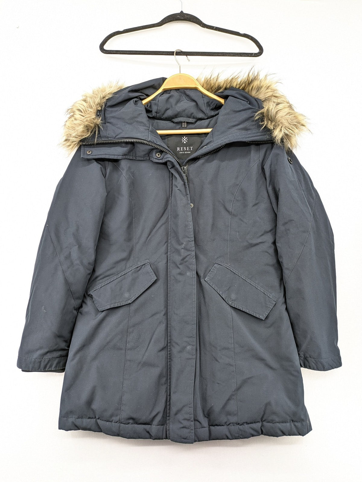 Reset Fifty Seven cream puffer coat with faux fur hood and down insulation.