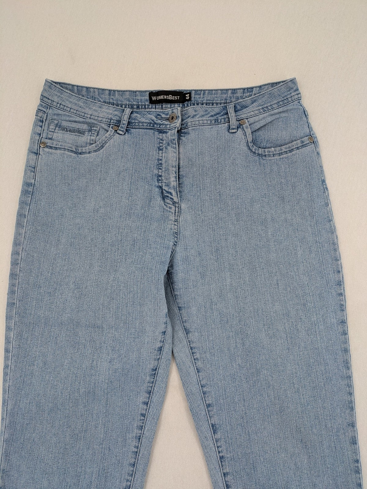 Capri blue straight jeans with 5-pocket design and embroidered details on back pockets.