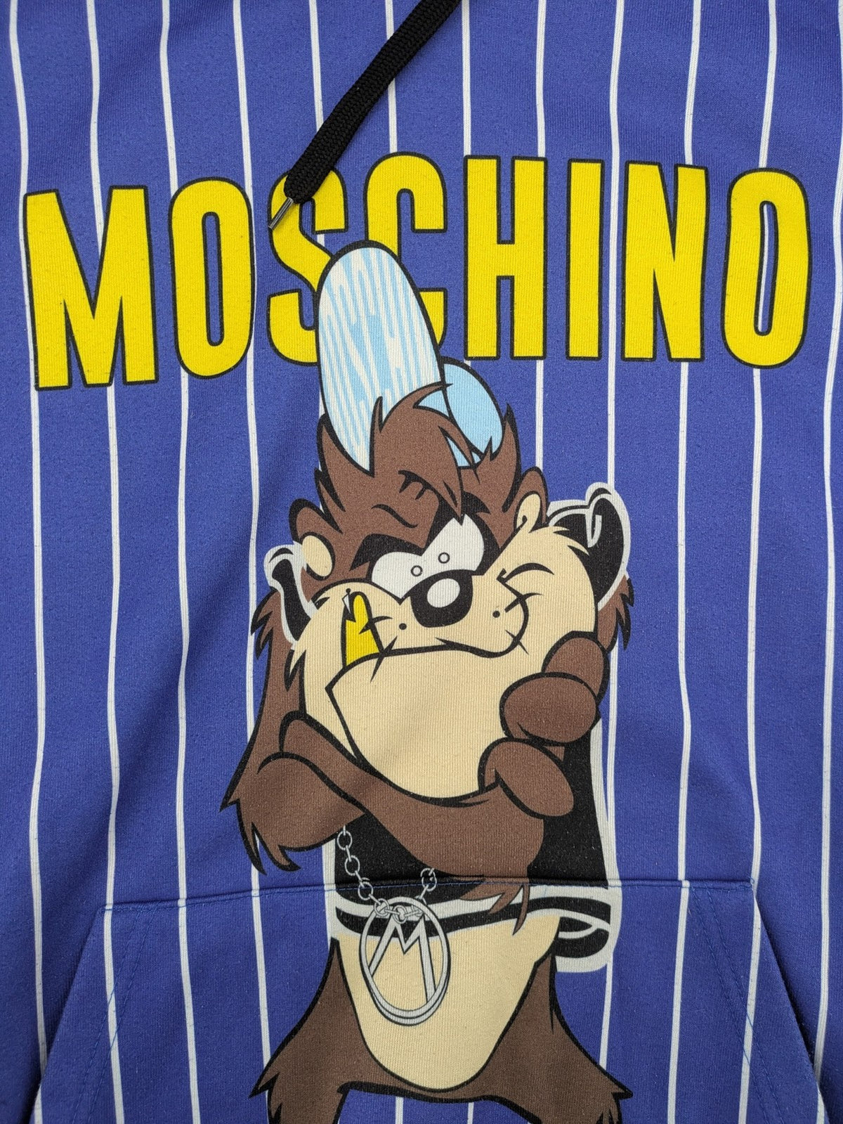 Moschino multi turtle neck jumper blue and white striped with Tasmanian Devil graphic.