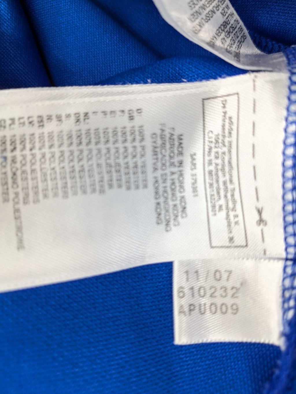 Adidas blue long sleeve top with white three stripes and 1/4 zip collar.
