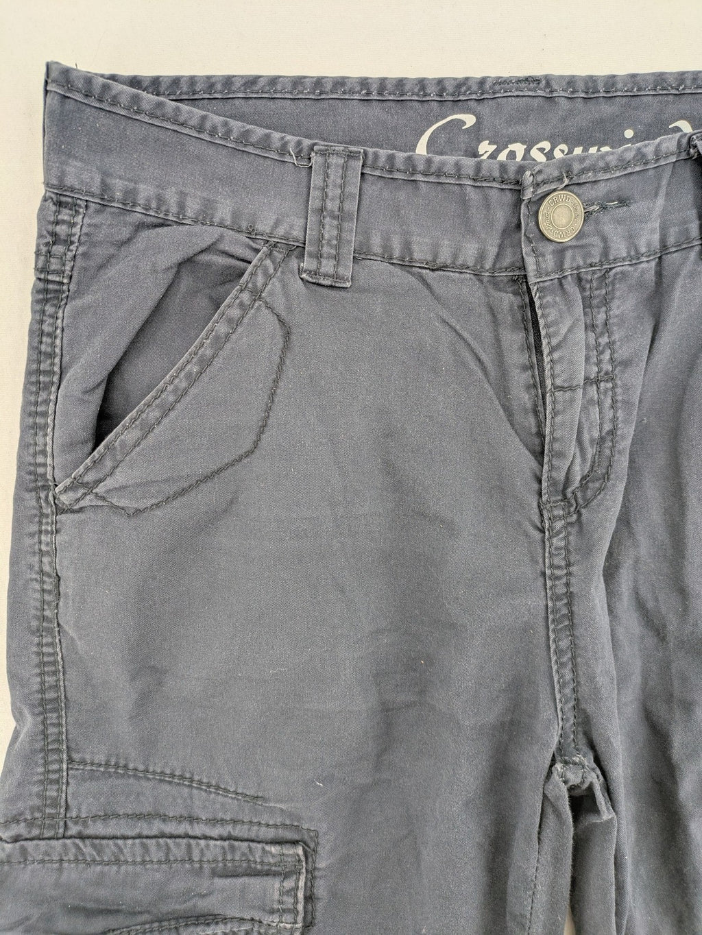 Crosswind grey cargo shorts with multiple pockets and durable cotton material.