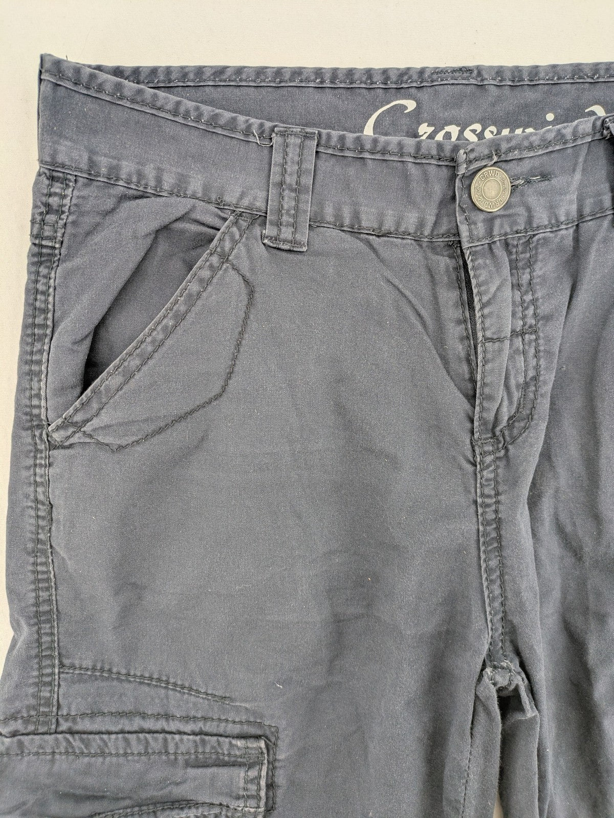 Crosswind grey cargo shorts with multiple pockets and durable cotton material.