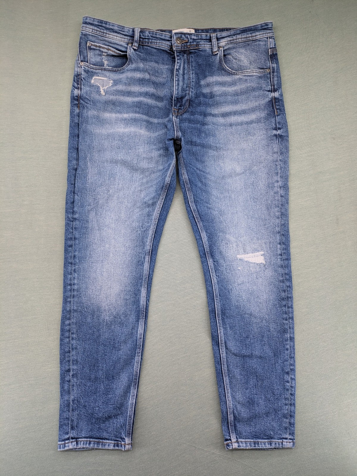 Pull&Bear blue straight jeans with distressed details and classic 5-pocket design.