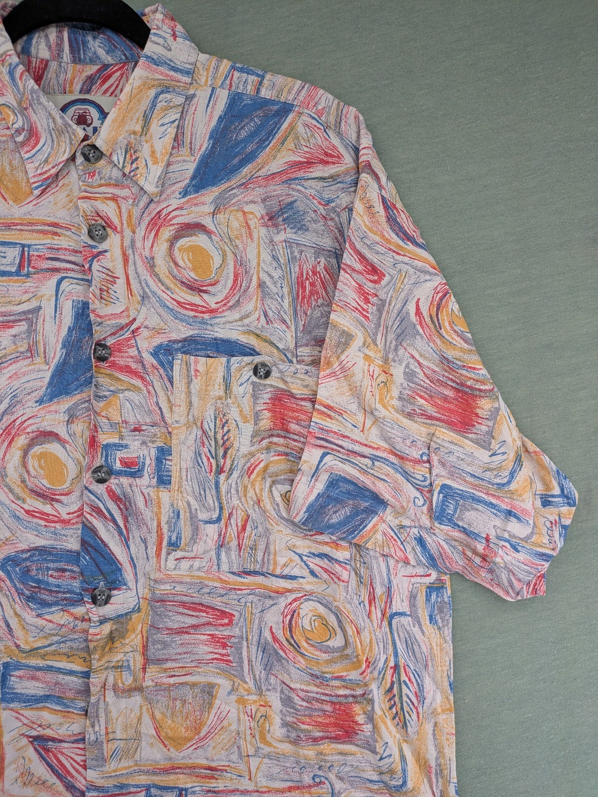 Limit short-sleeve shirt multi-coloured abstract pattern, lightweight viscose, chest pocket detail.