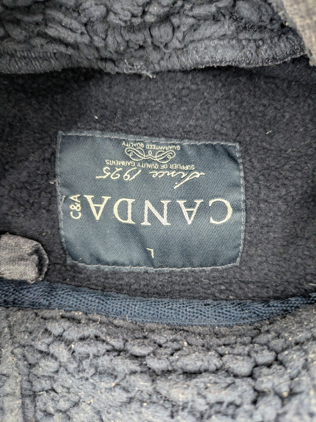 C&A grey hoodie with embossed chest logo, teddy-lined hood, and side zip pockets.