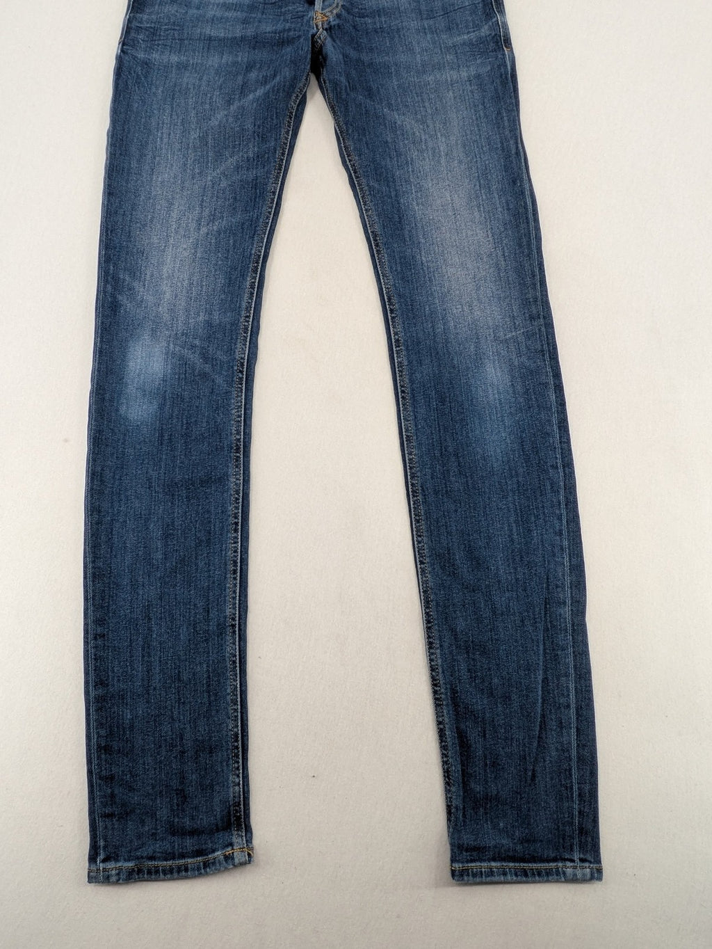 Diesel blue slim skinny jeans with logo patch and stretch denim material.