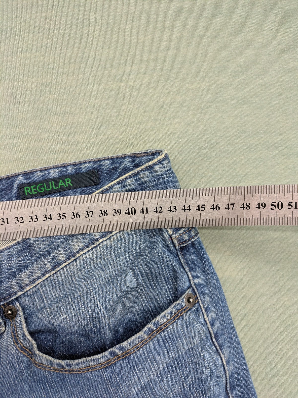 Benetton Jeans blue straight leg denim with button fly and classic design.