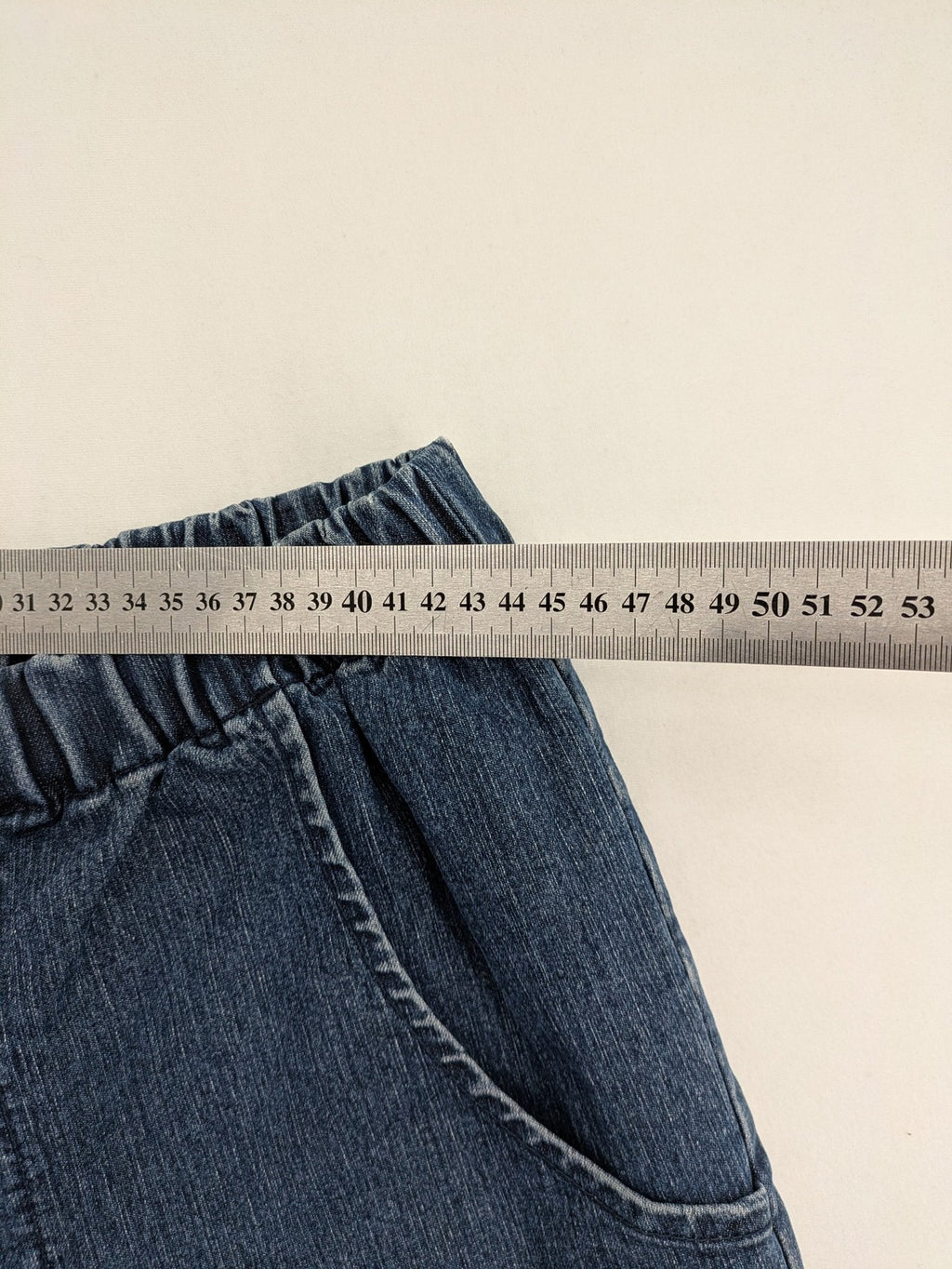 Denim & Co. blue capri jeans with elastic waistband and embellished rhinestones.