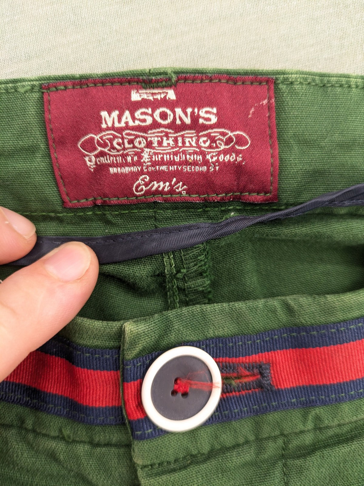 Mason's green chino pants with striped red and blue waistband, cotton stretch material.