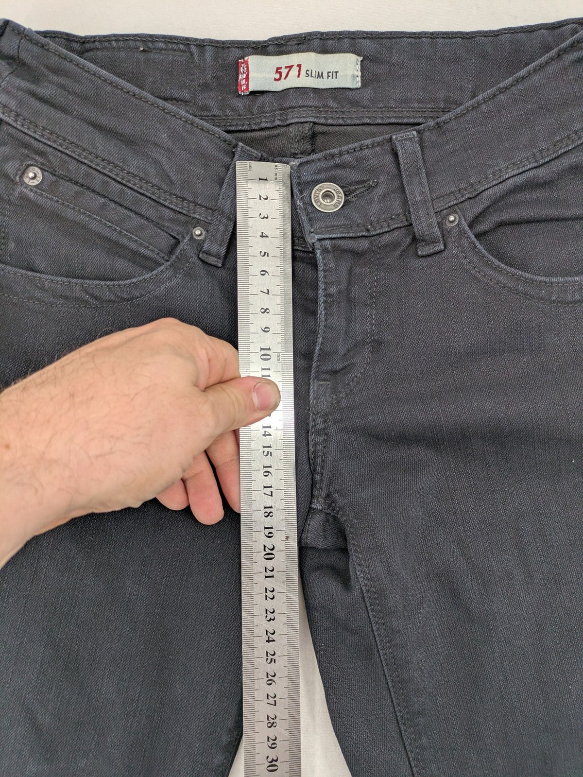 Levi's black slim fit jeans with classic 5-pocket design and zipper fly.