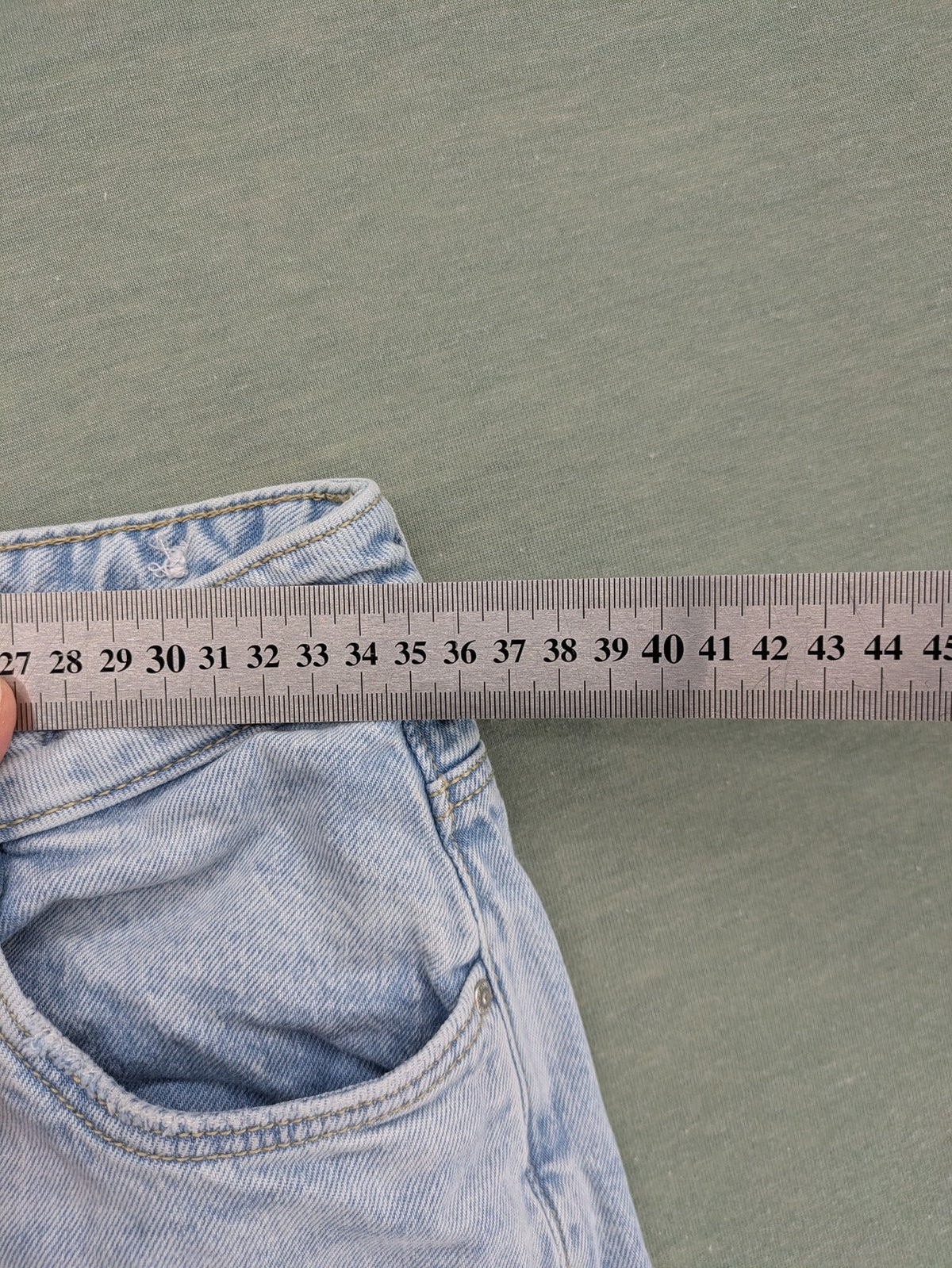C&A blue wide leg jeans with distressed knee details and classic five-pocket design.